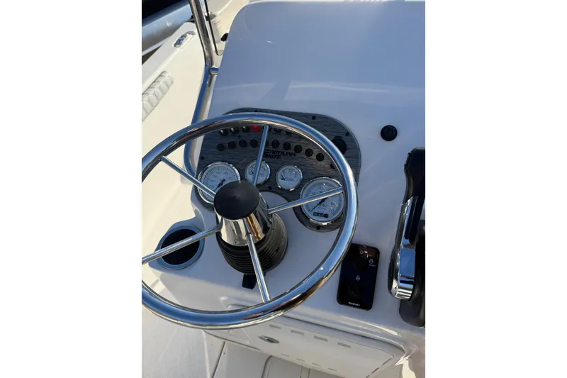 Slide: The Image of Steering console of 2025 Carolina Skiff 19 LS boat with gauges and controls. - 12