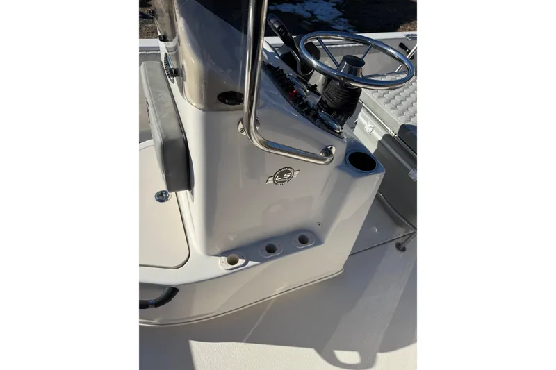 Slide: The Image of 2025 Carolina Skiff 19 LS boat console with steering wheel and controls. - 15