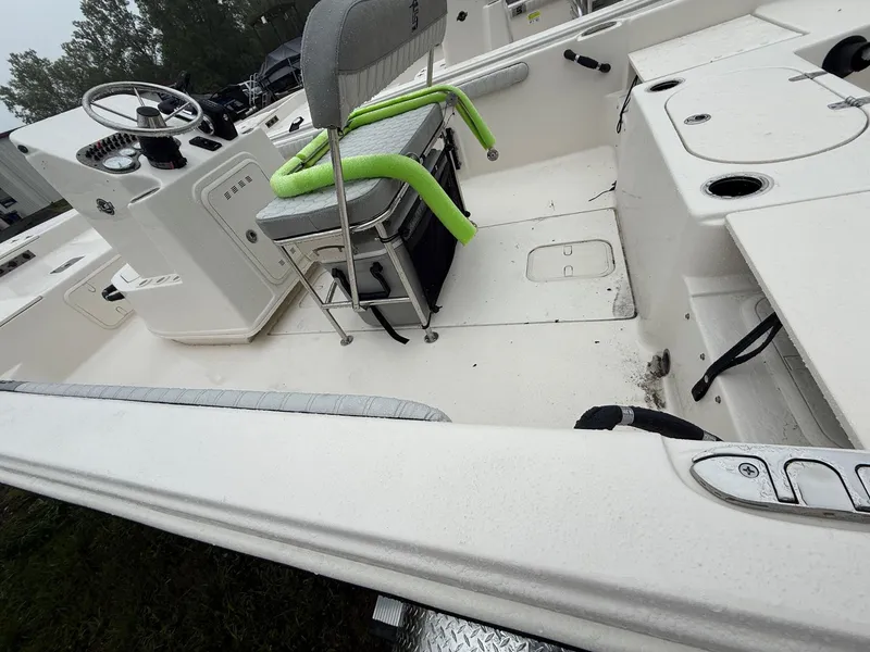 Slide: The Image of 2025 Carolina Skiff 19 LS boat logo on light blue and white hull. - 2