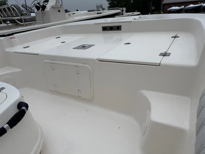 Slide: The Image of 2025 Carolina Skiff 19 LS boat with a foldable swim ladder on a trailer. - 5