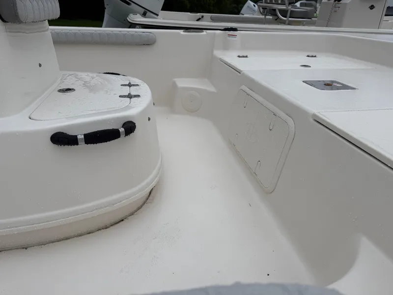 Slide: The Image of 2025 Carolina Skiff 19 LS boat interior, featuring seating and storage compartments. - 7