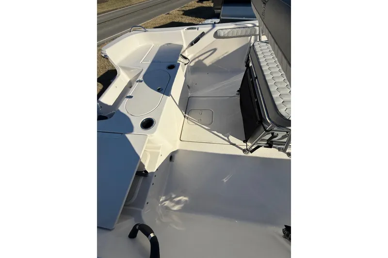 Slide: The Image of 2025 Carolina Skiff 19 LS boat interior with seating and storage compartments. - 8