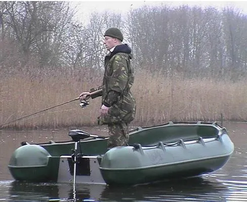 Slide: The Image of Man fishing on a 2025 Whaly 370 Console boat in a calm lake. - 5