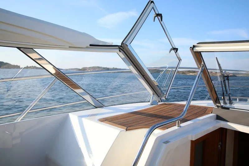 Slide: The Image of 2025 Marex 360 Cabriolet Cruiser on open water, showcasing sleek design and panoramic views. - 16
