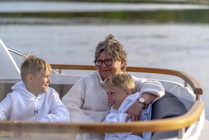 Slide: The Image of Family enjoying a relaxing moment on a 2025 Marex 360 Cabriolet Cruiser. - 25