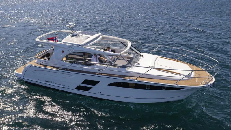 Slide: The Image of 2025 Marex 360 Cabriolet Cruiser on open water, showcasing sleek design and luxury features. - 14