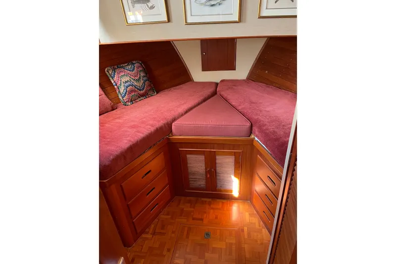 Slide: The Image of Interior of 1991 Grand Banks 46 Motoryacht with wooden table and cushioned seating. - 14