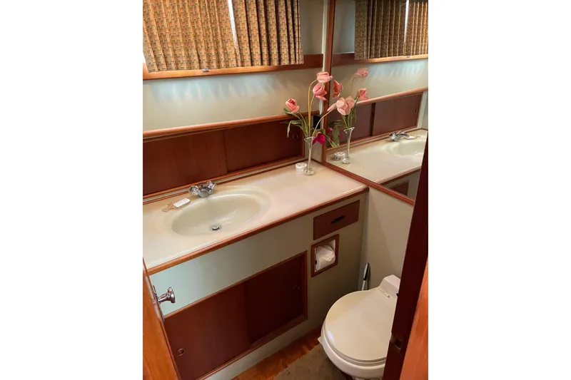Slide: The Image of Interior of 1991 Grand Banks 46 Motoryacht kitchen with wooden cabinets and sink. - 16