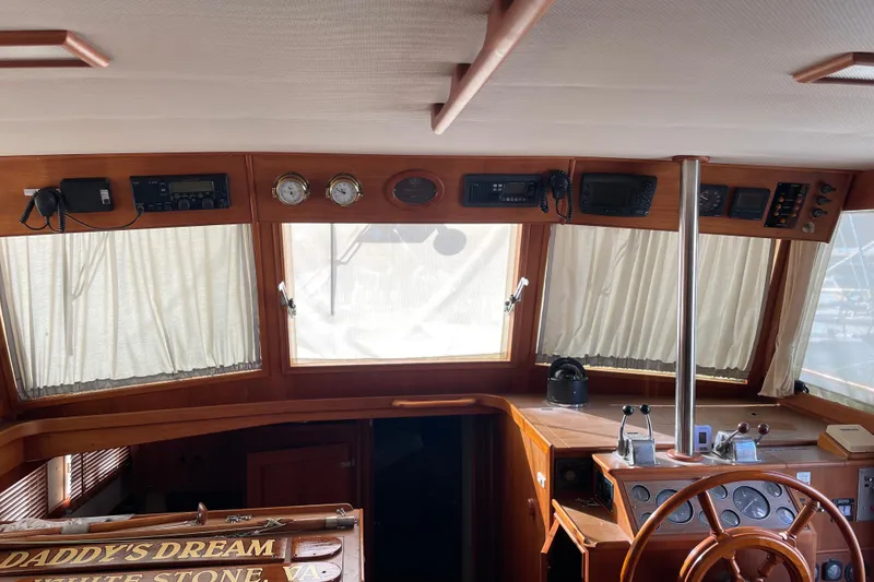 Slide: The Image of Luxurious bedroom interior of 1991 Grand Banks 46 Motoryacht with geometric bedding design. - 28