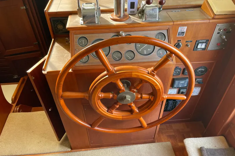 Slide: The Image of 1991 Grand Banks 46 Motoryacht interior with wooden desk and storage drawers. - 31