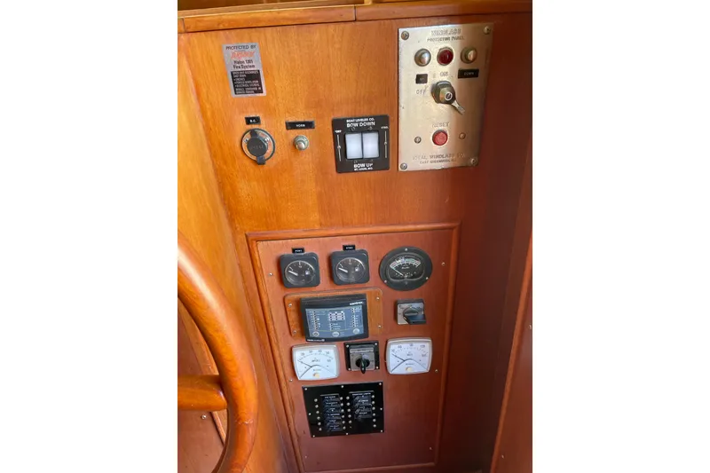 Slide: The Image of Control panel of a 1991 Grand Banks 46 Motoryacht with labeled switches and battery selector. - 32