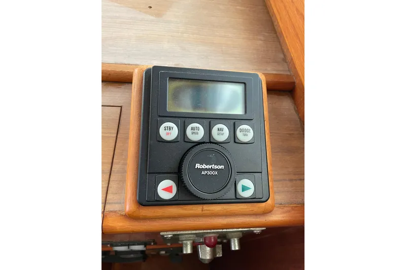 Slide: The Image of Interior helm of 1991 Grand Banks 46 Motoryacht with wooden steering wheel and navigation instruments. - 35