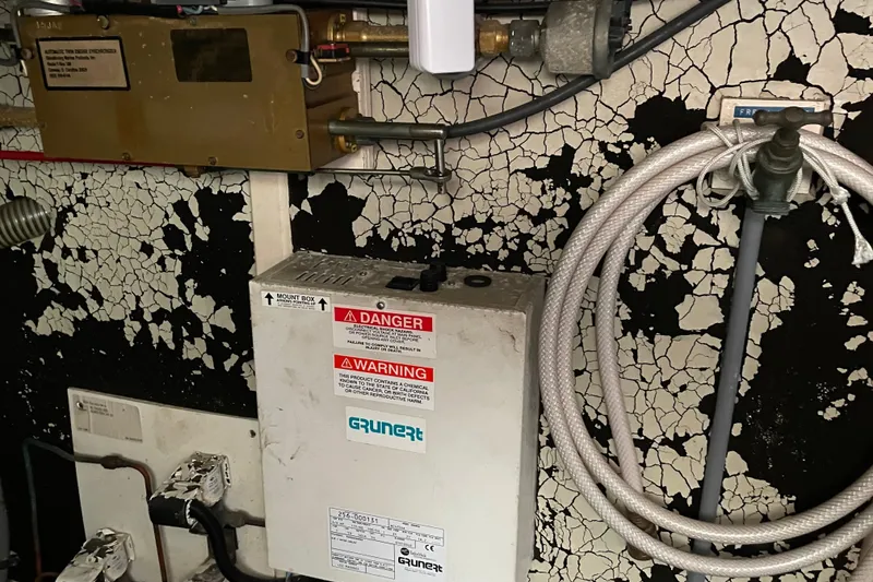 Slide: The Image of Control panel of a 1991 Grand Banks 46 Motoryacht with gauges and switches. - 36