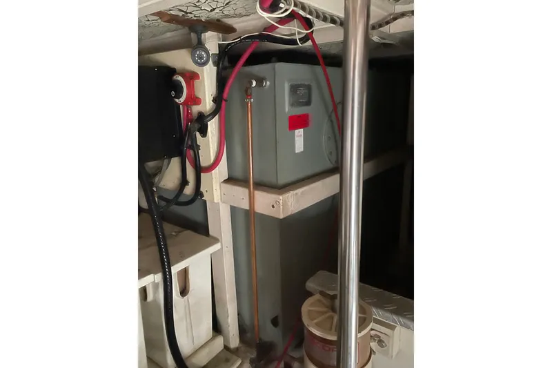 Slide: The Image of Engine room of 1991 Grand Banks 46 Motoryacht with electrical and plumbing components. - 48