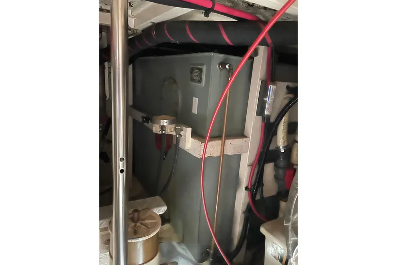Slide: The Image of Engine room of 1991 Grand Banks 46 Motoryacht with visible fuel tank and piping. - 49