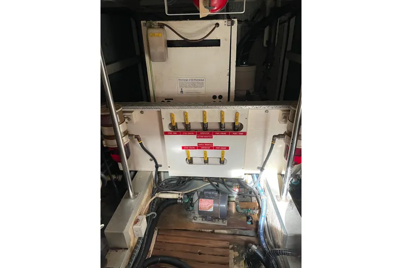 Slide: The Image of Engine room of 1991 Grand Banks 46 Motoryacht with control panel and wiring. - 51