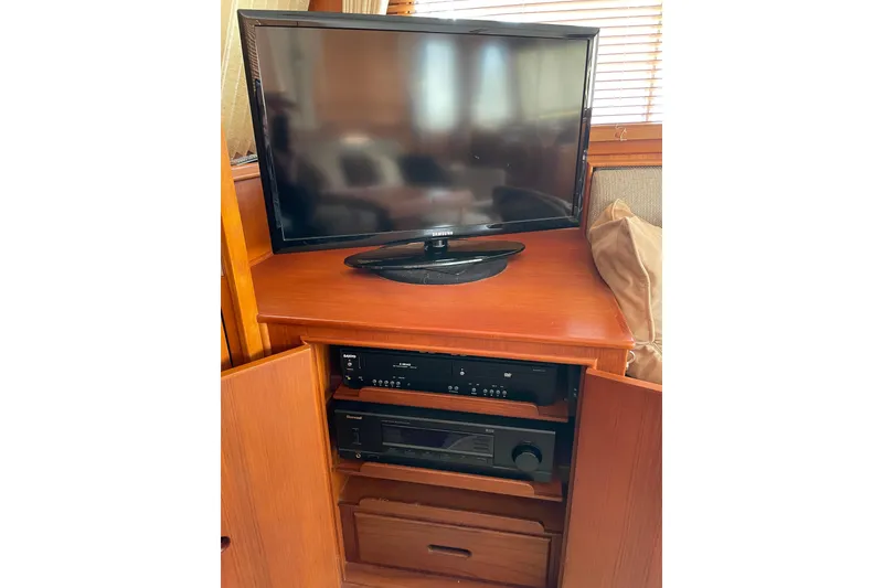 Slide: The Image of Entertainment center with TV and audio equipment on 1991 Grand Banks 46 Motoryacht. - 54