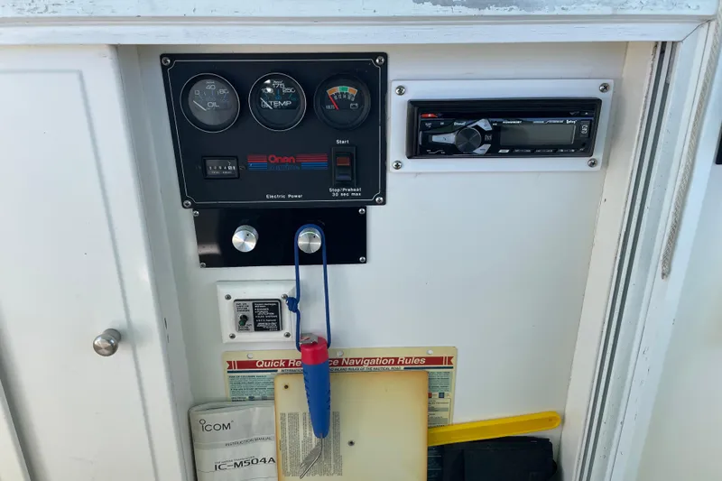 Slide: The Image of Control panel of a 1991 Grand Banks 46 Motoryacht with gauges and stereo system. - 62