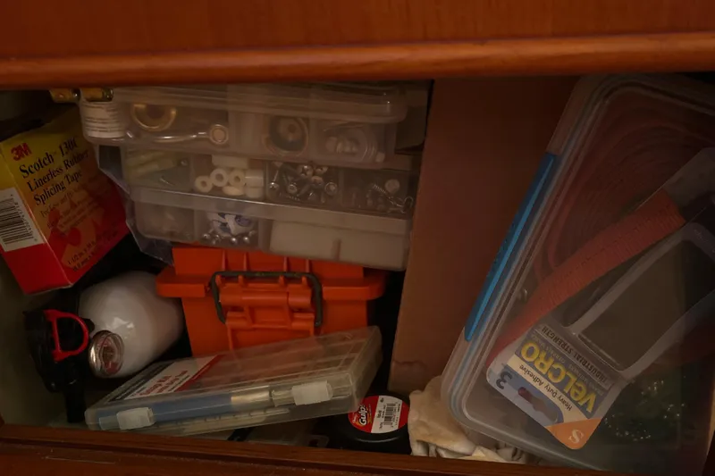Slide: The Image of Storage compartment with tools and supplies on a 1991 Grand Banks 46 Motoryacht. - 63