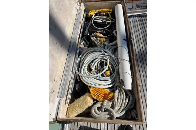 Slide: The Image of Storage compartment on 1991 Grand Banks 46 Motoryacht with ropes and equipment. - 67