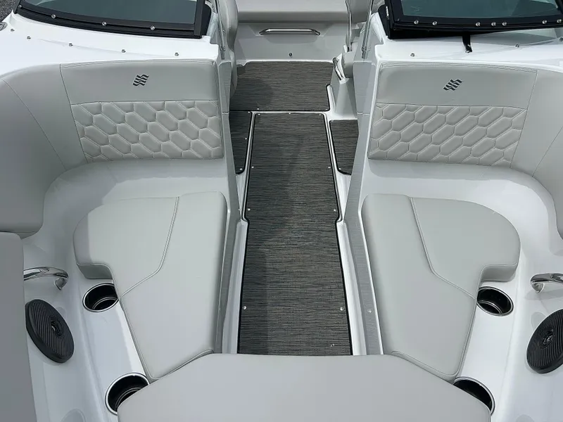 Slide: The Image of 2025 Four Winns H2 Freedom boat interior with gray seating and modern design. - 12