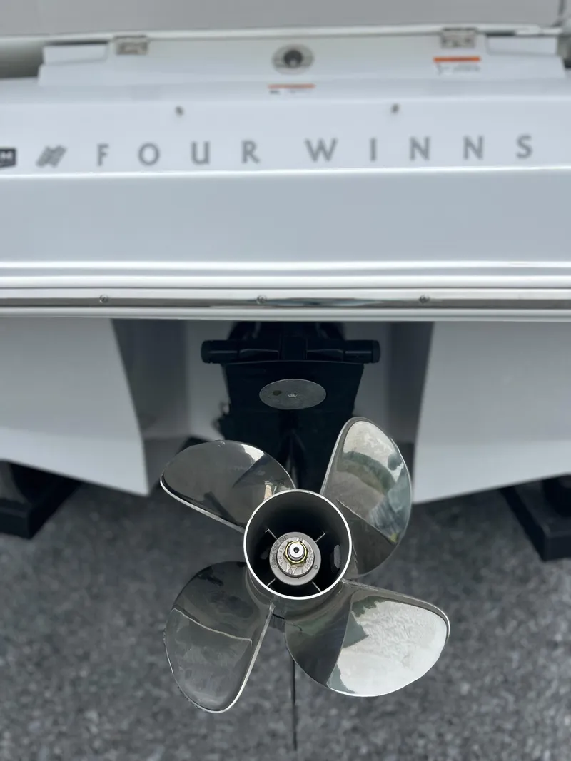 Slide: The Image of 2025 Four Winns H2 Freedom boat propeller and stern detail. - 6
