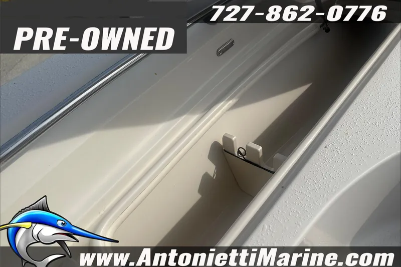Slide: The Image of Pre-owned 2020 Sea Chaser 23 LX boat storage compartment, Antonietti Marine contact details. - 11