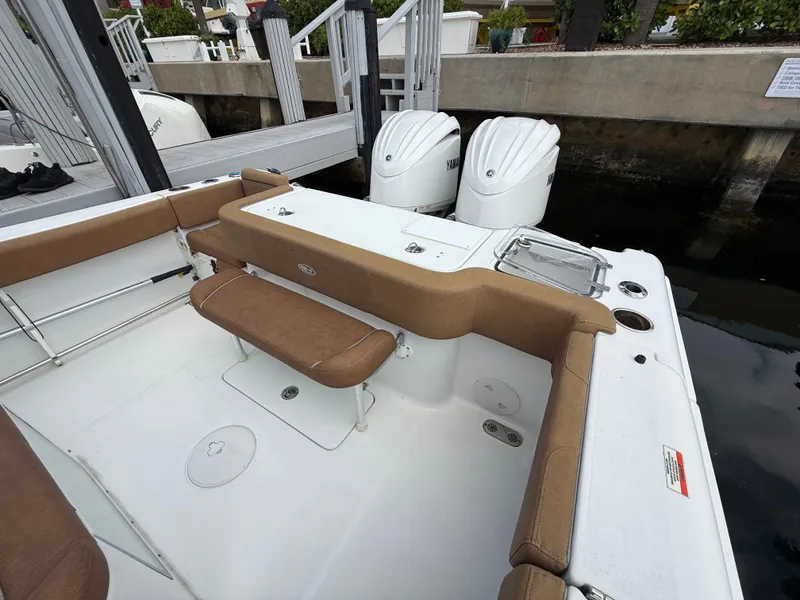 Slide: The Image of 2023 Sea Hunt Gamefish 30 boat with forward seating and twin outboard engines. - 21