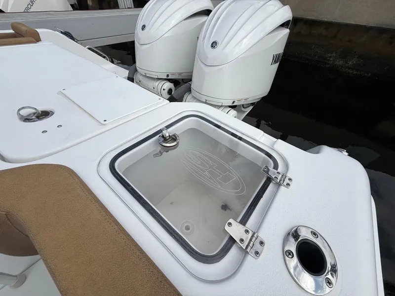 Slide: The Image of 2023 Sea Hunt Gamefish 30 boat with dual Yamaha engines and forward seating. - 24