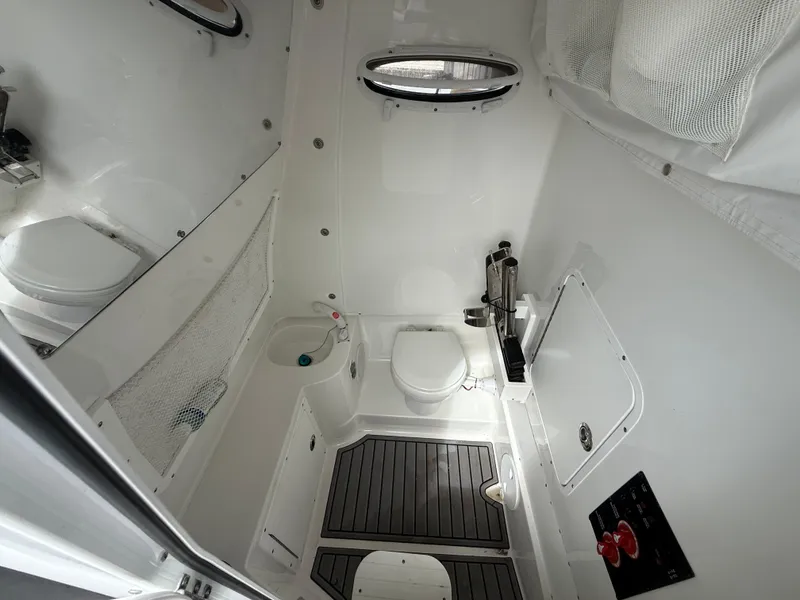 Slide: The Image of 2023 Sea Hunt Gamefish 30 boat interior with modern bathroom amenities and sleek design. - 7