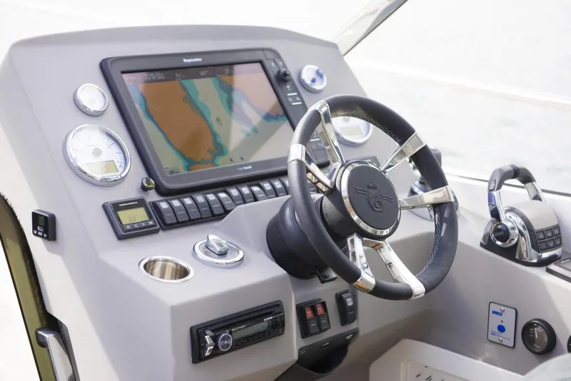 Slide: The Image of Helm of 2025 Marex 375 boat featuring advanced navigation system and controls. - 19