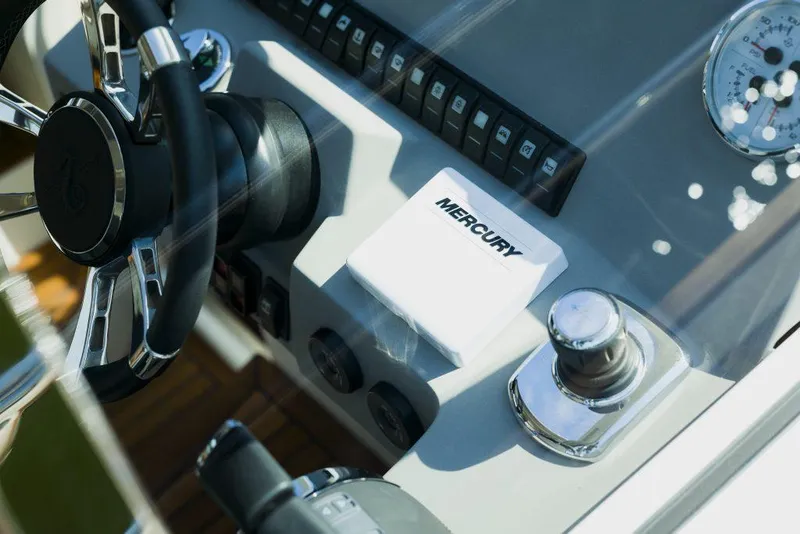 Slide: The Image of Helm of 2025 Marex 375 boat with Mercury controls and steering wheel. - 23