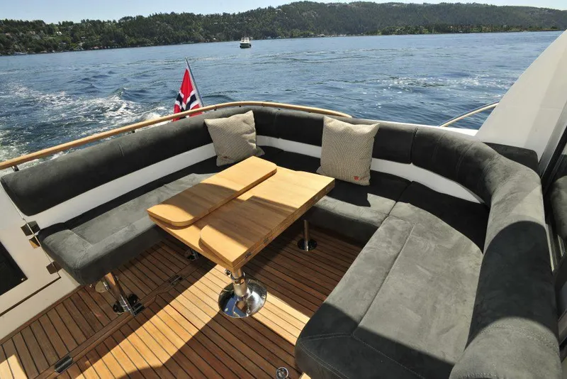 Slide: The Image of Luxury seating area on 2025 Marex 375 yacht with scenic water view. - 27
