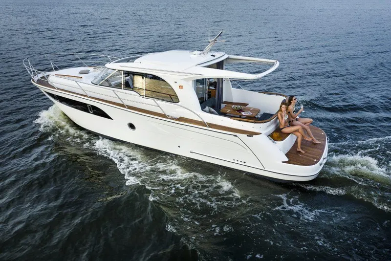 Slide: The Image of 2025 Marex 375 yacht cruising with passengers on deck, enjoying the water. - 40