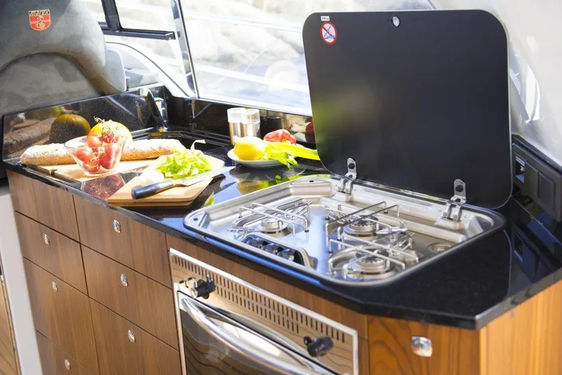 Slide: The Image of Modern kitchen in 2025 Marex 375 boat with stove, fresh vegetables, and sleek cabinetry. - 21