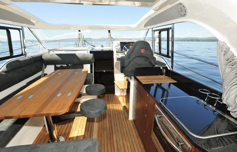 Slide: The Image of Interior of 2025 Marex 375 yacht with modern seating and wooden flooring. - 29