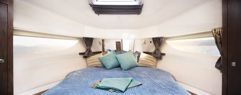 Slide: The Image of Luxurious cabin interior of 2025 Marex 375 yacht with cozy bedding and elegant decor. - 30