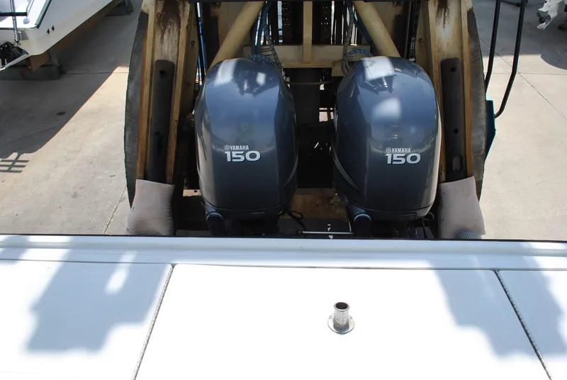 Slide: The Image of Twin Yamaha 150 engines on a 1987 Halter 31 Lafitte Skiff boat. - 30