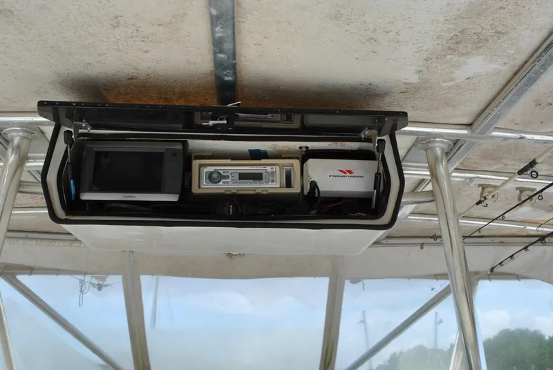 Slide: The Image of Overhead console on 1987 Halter 31 Lafitte Skiff with electronic equipment. - 31