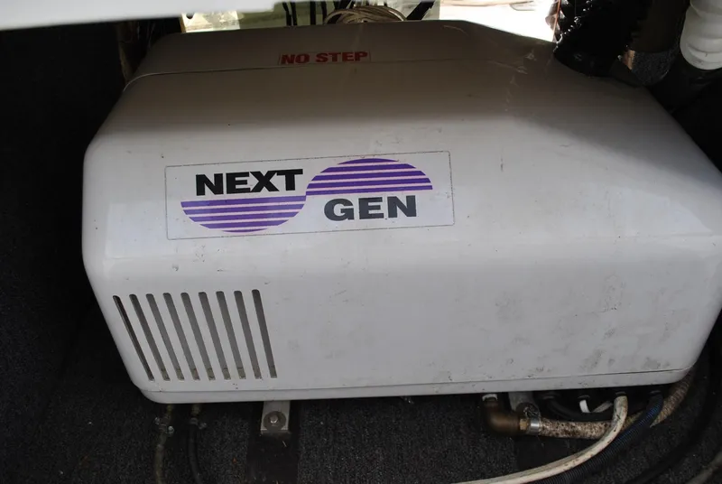Slide: The Image of Next Gen generator in 1987 Halter 31 Lafitte Skiff engine compartment. - 33