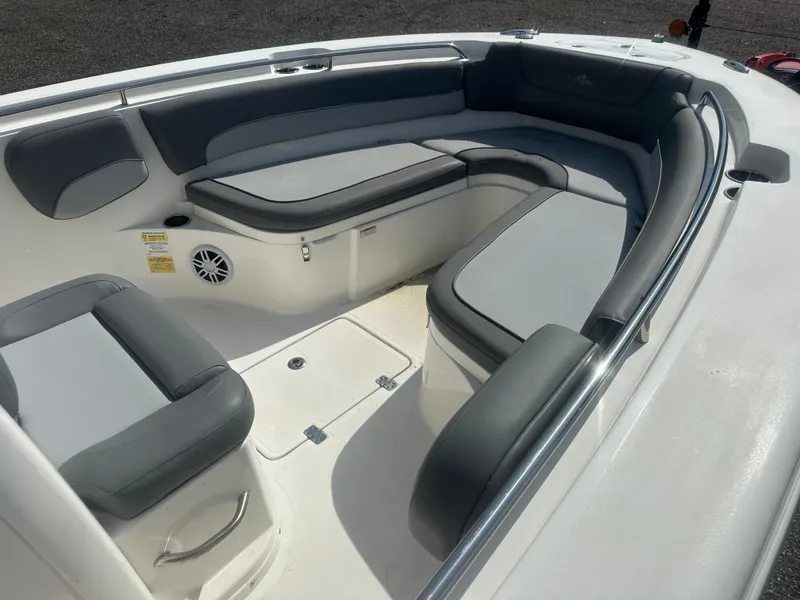 Slide: The Image of 2023 NauticStar 2602 Legacy boat interior with cushioned seating and storage. - 10