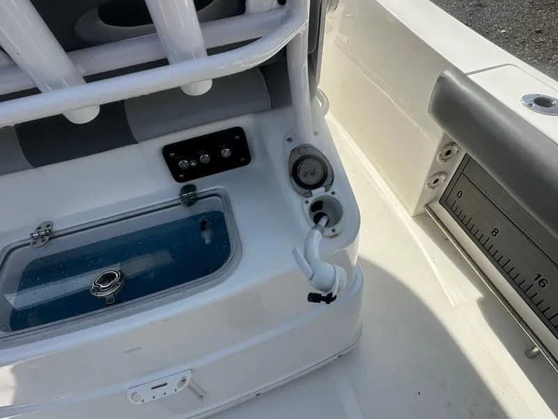 Slide: The Image of 2023 NauticStar 2602 Legacy boat interior with livewell and control panel. - 24