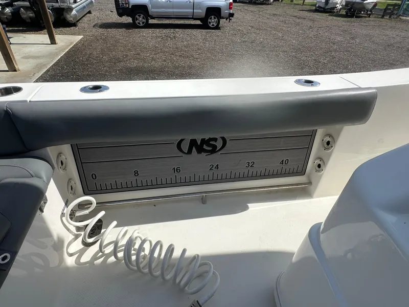 Slide: The Image of 2023 NauticStar 2602 Legacy boat with built-in measuring ruler on deck. - 26