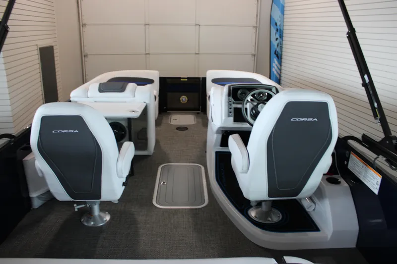 Slide: The Image of 2025 Barletta Corsa 23UC boat interior with modern seating and steering console. - 15