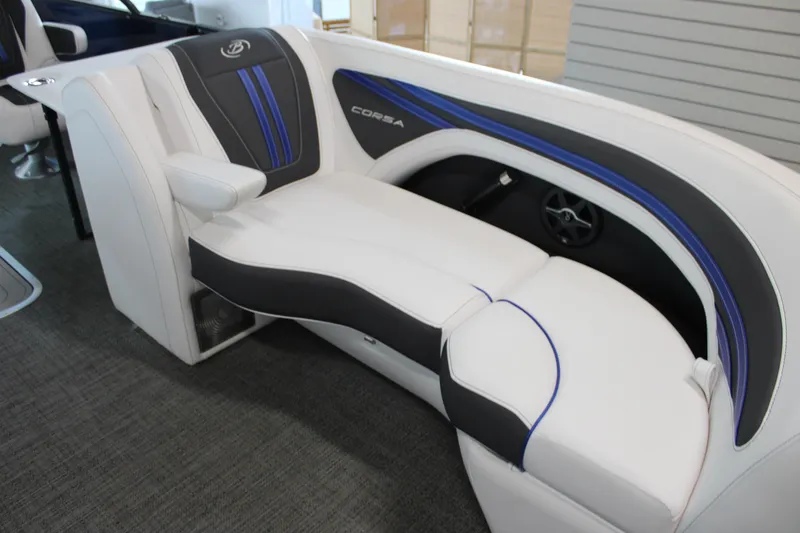 Slide: The Image of 2025 Barletta Corsa 23UC boat interior with sleek white and blue seating. - 18