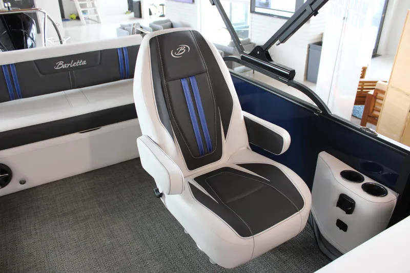 Slide: The Image of Captain's chair in 2025 Barletta Corsa 23UC boat, featuring sleek design and blue accents. - 20