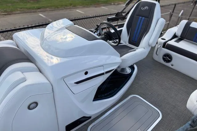 Slide: The Image of 2025 Barletta Corsa 23UC boat interior with sleek white and black seating and modern controls. - 26