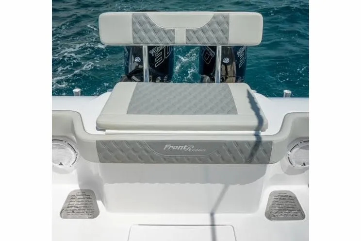 Slide: The Image of 2026 Front Runner 33 Center Console boat interior with modern controls and seating. - 11