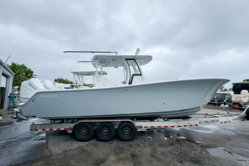 Slide: The Image of 2026 Front Runner 33 Center Console boat interior with speakers, showcasing sleek design. - 15