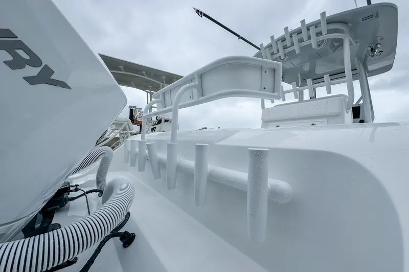 Slide: The Image of 2026 Front Runner 33 Center Console boat with white cushioned seating. - 19